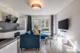 Wohnzimmer mit Küche - Neuwertige 2-Zimmerwohnung mit Terrasse & Garage in Braunschweig! Meine Immobilie = Mein Partner!