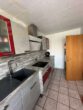 Küche - Familienfreundliches Reihenmittelhaus in ruhiger Lage – mit Carport