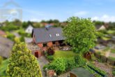 Hausansicht - Gepflegtes Einfamilienhaus mit großem Garten, Terrasse und Tandemgarage!Meine Immobilie=Mein Partner