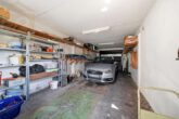 Garage - Gepflegtes Einfamilienhaus mit großem Garten, Terrasse und Tandemgarage!Meine Immobilie=Mein Partner